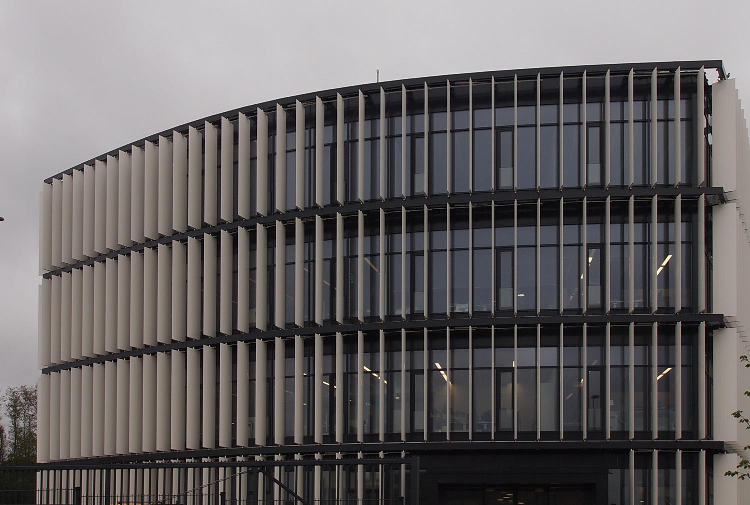 Vertical shading fins fitted directly outside rows of glass windows